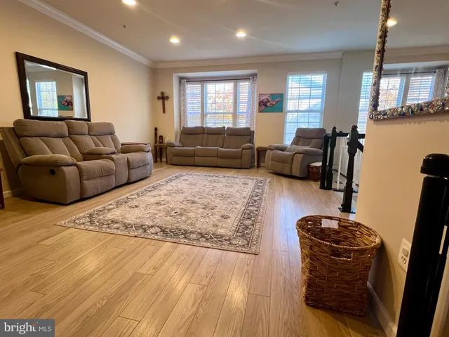 a living room with a couch and a rug