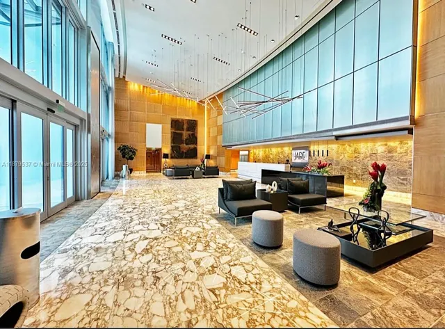 a bathroom with a sink and a chandelier