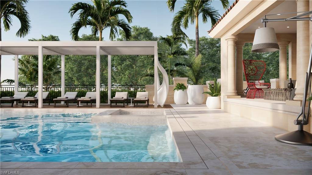 1301 3rd Avenue South, Unit PHW Naples, FL 34102 - Photo 22 of 29 a view of a house with backyard and swimming pool