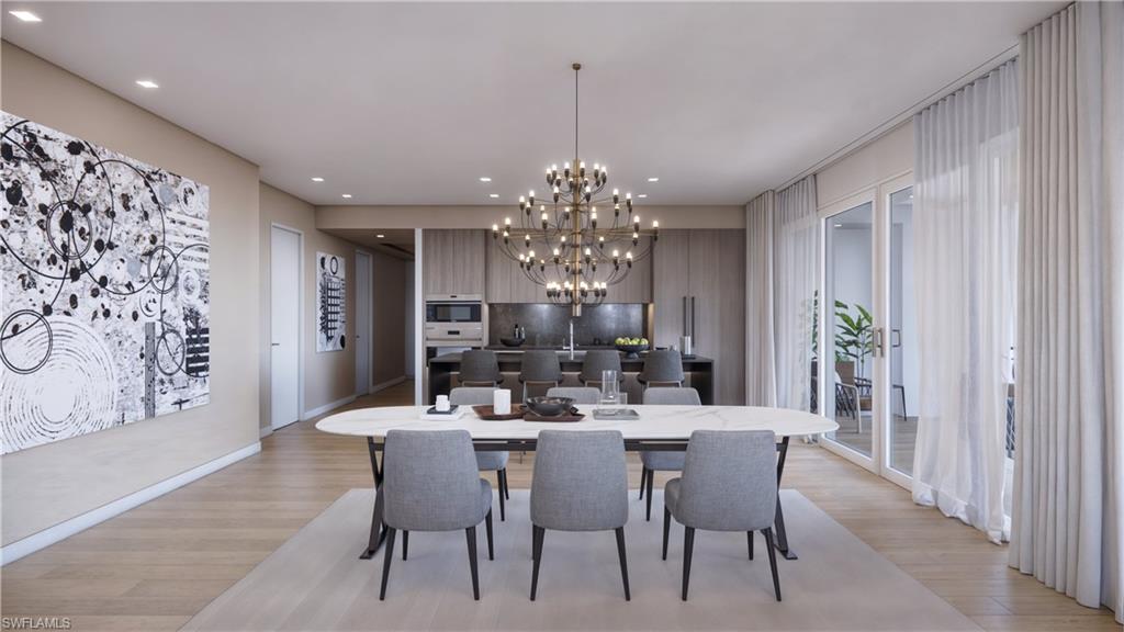 1301 3rd Avenue South, Unit PHW Naples, FL 34102 - Photo 6 of 29 a view of a dining room with furniture and chandelier