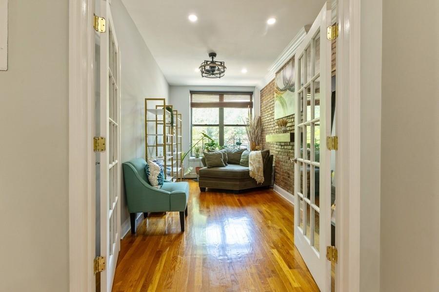 100 Ralph Avenue, Unit 2L Brooklyn, NY 11221 - Photo 4 of 15 a living room with furniture and a large window