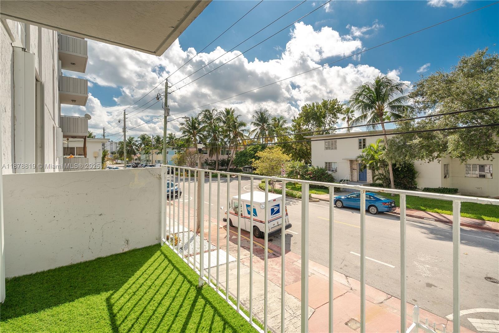 8305 Crespi Boulevard, Unit 2D Miami Beach, FL 33141 - Photo 16 of 33 a view of a balcony with wooden floor