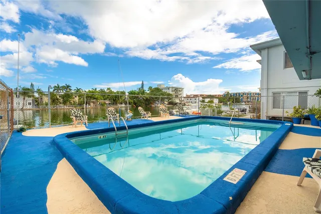 a view of a balcony with a swimming pool