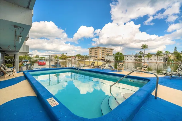 a view of a swimming pool with a terrace