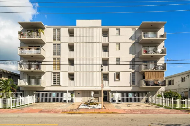 a front view of a building with a street
