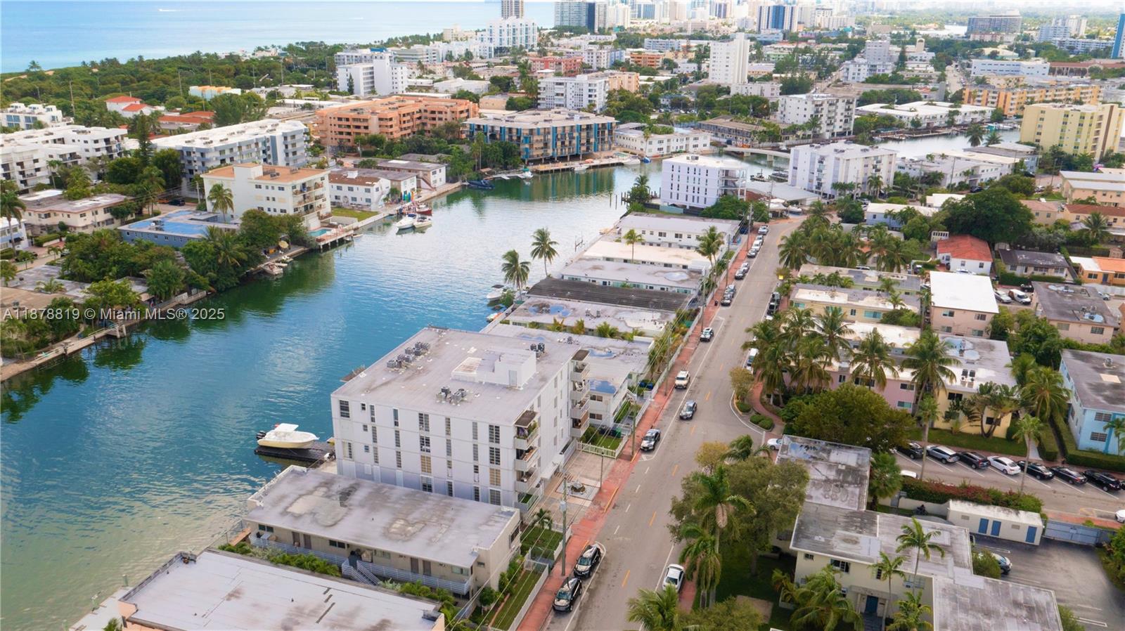 8305 Crespi Boulevard, Unit 2D Miami Beach, FL 33141 - Photo 26 of 33 an aerial view of lake and residential houses with outdoor space