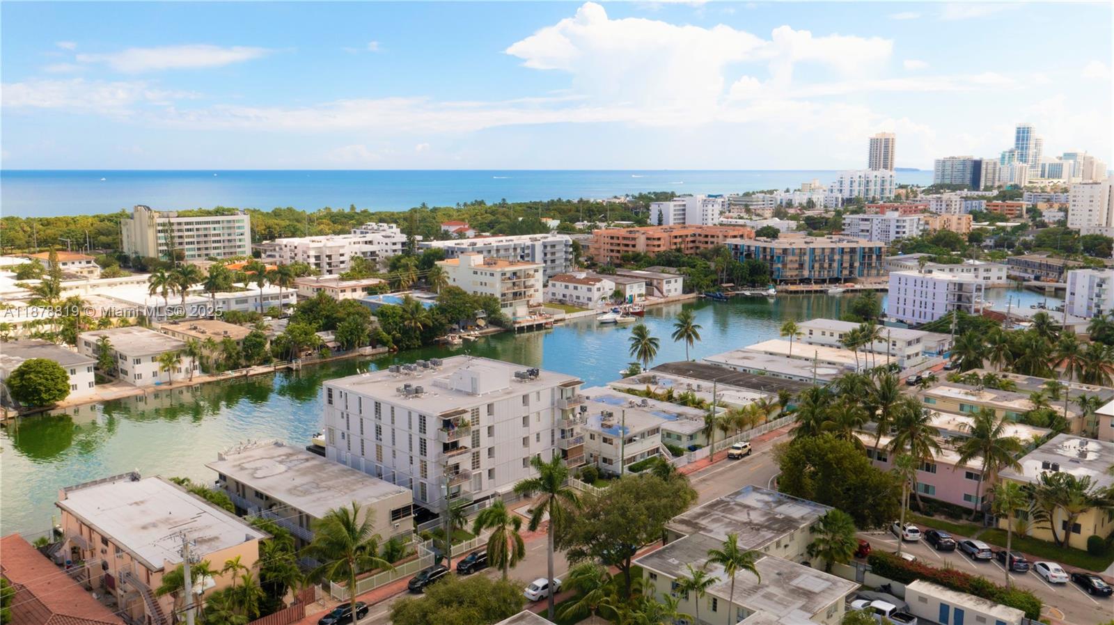 8305 Crespi Boulevard, Unit 2D Miami Beach, FL 33141 - Photo 27 of 33 an aerial view of a city with lots of residential buildings lake and ocean view