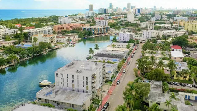 an aerial view of a city with lake view