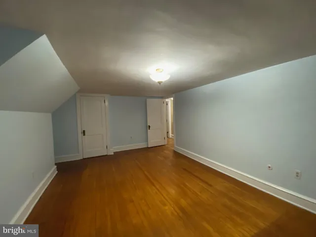 a view of a room with window wooden floor and windows