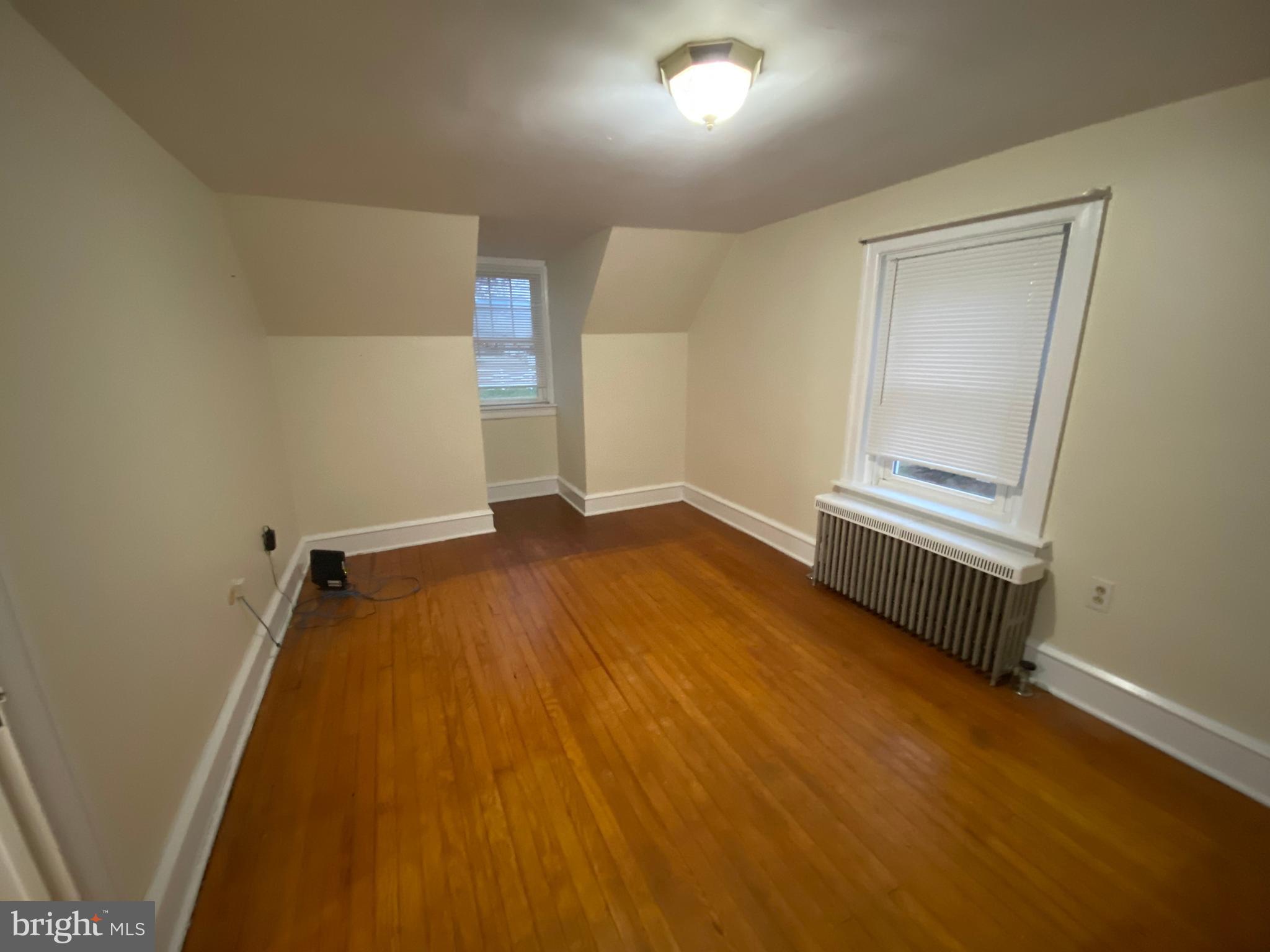 2012 Old Forty Foot Road Harleysville, PA 19438 - Photo 20 of 36 an empty room with wooden floor and windows