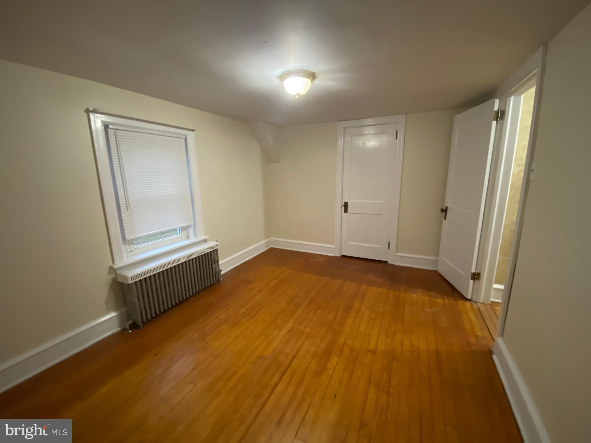 2012 Old Forty Foot Road Harleysville, PA 19438 - Photo 21 of 36 a view of an empty room with wooden floor and a window