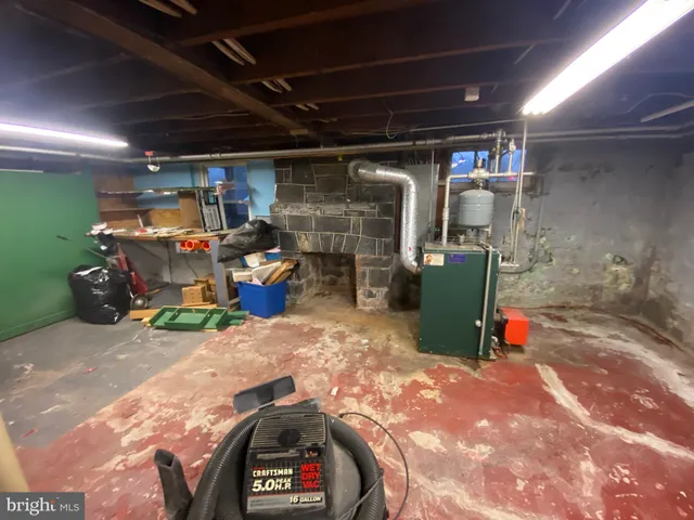 a utility room with multiple dryer and washer