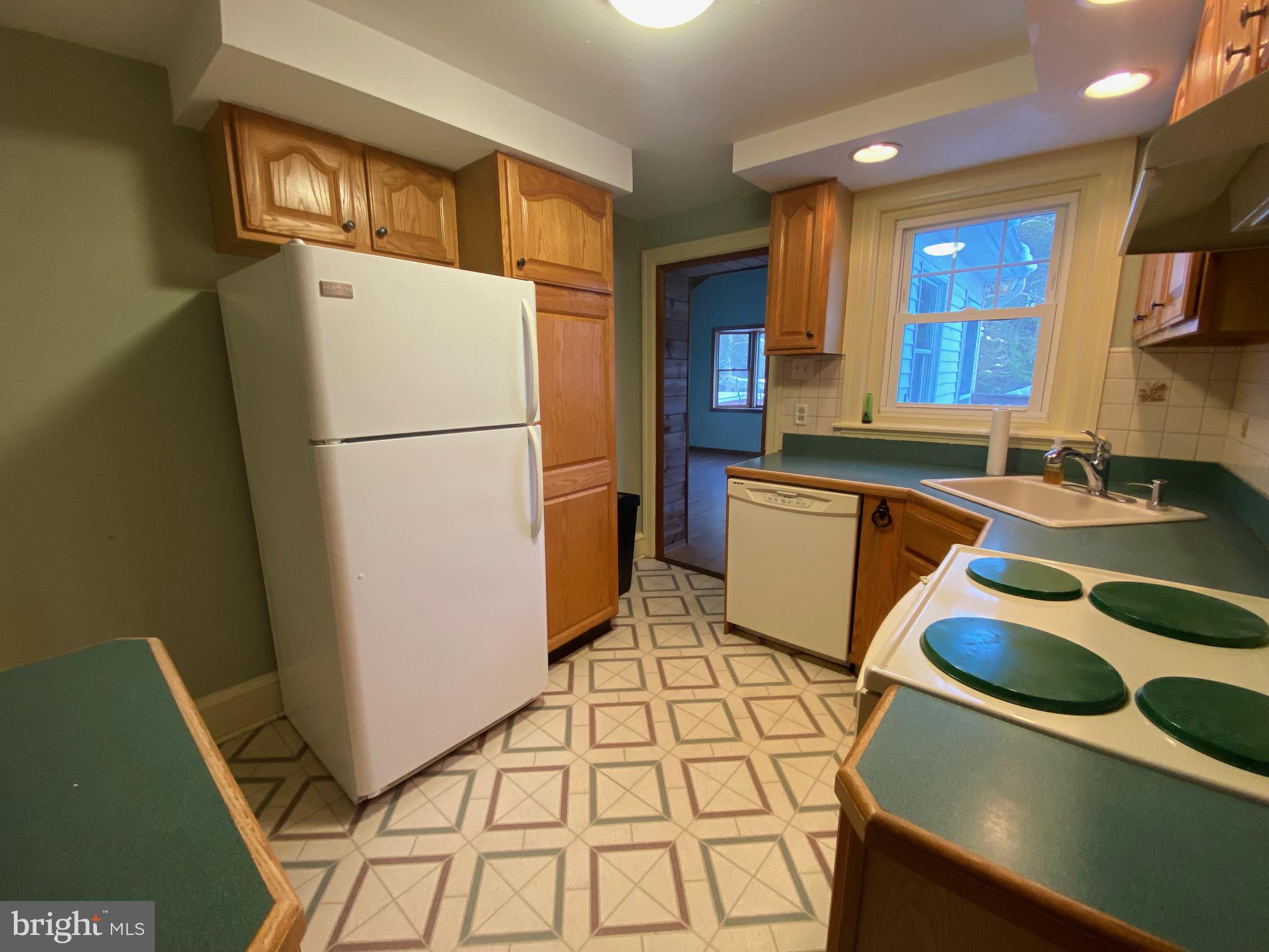 2012 Old Forty Foot Road Harleysville, PA 19438 - Photo 8 of 36 a kitchen with a refrigerator and a sink