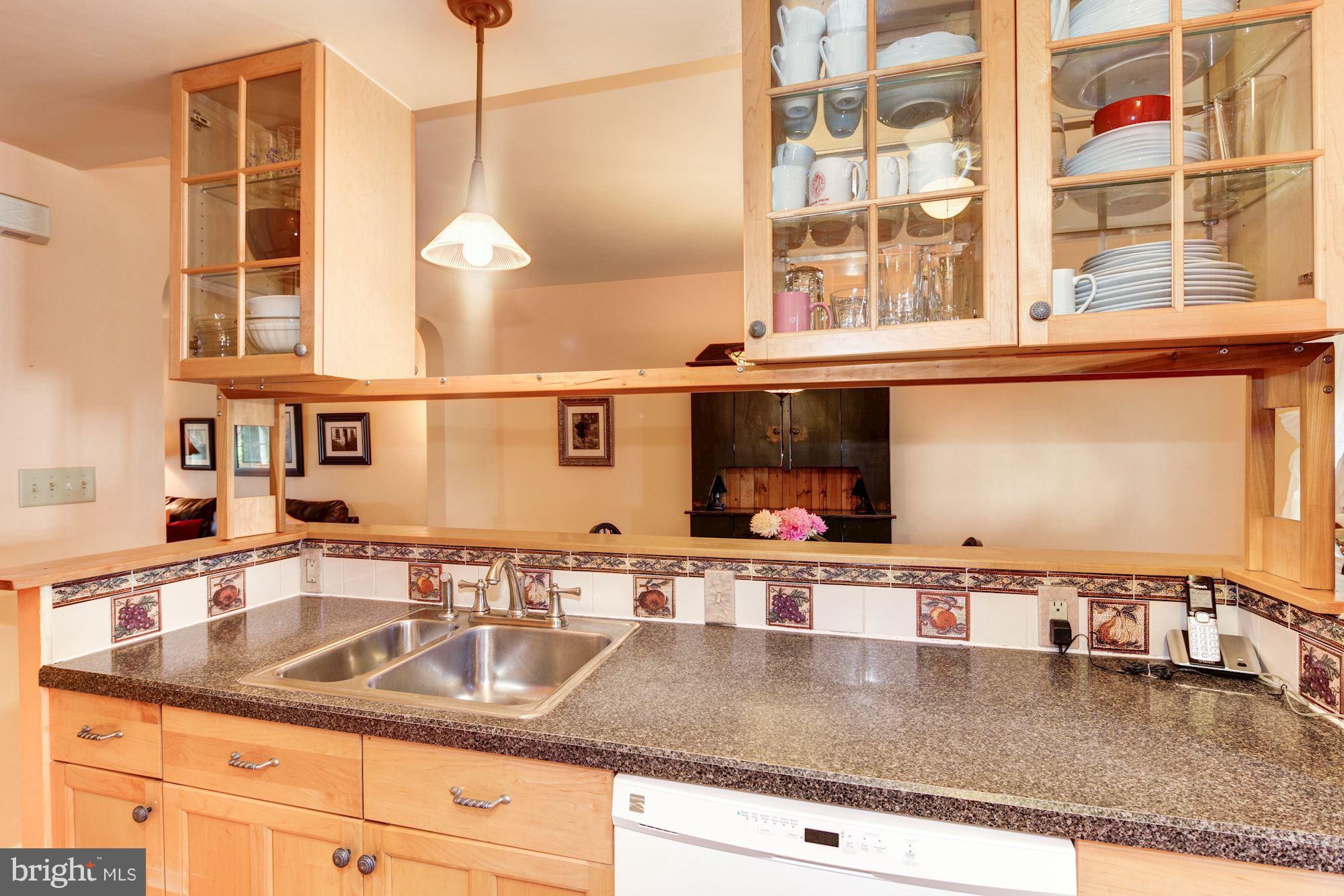 222 Ridge Avenue Baltimore, MD 21286 - Photo 12 of 30 a kitchen with kitchen island a sink and a counter top space