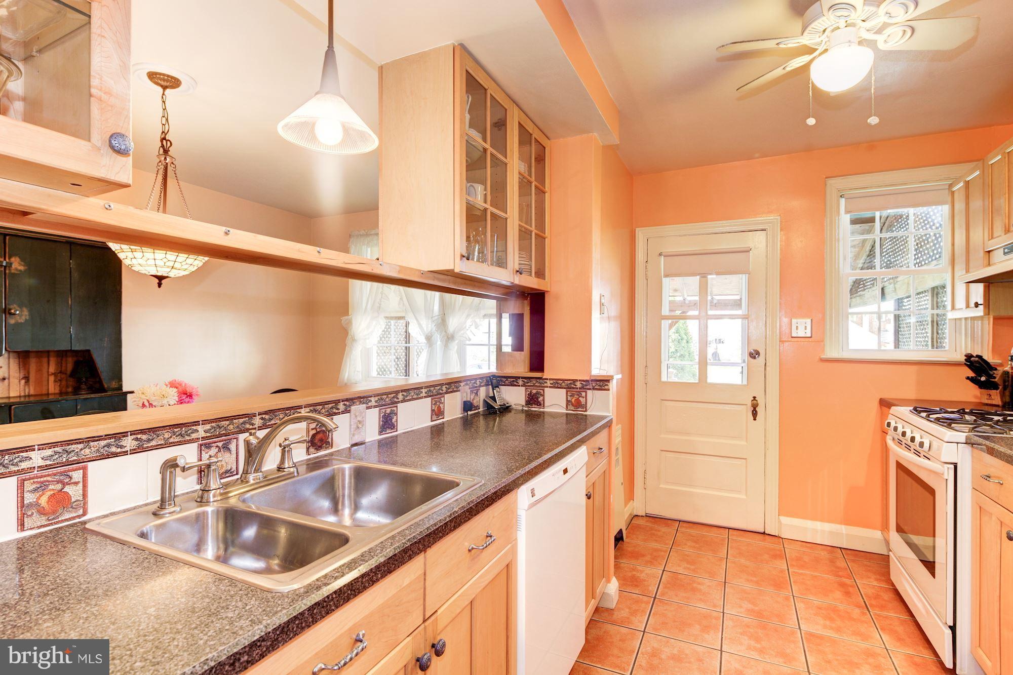 222 Ridge Avenue Baltimore, MD 21286 - Photo 10 of 30 a kitchen with stainless steel appliances granite countertop a sink and a counter space