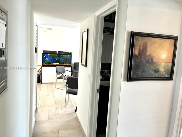 a view of a living room with a wooden floor