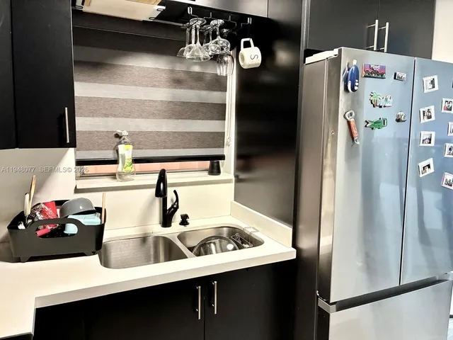 a bathroom with a sink and mirror