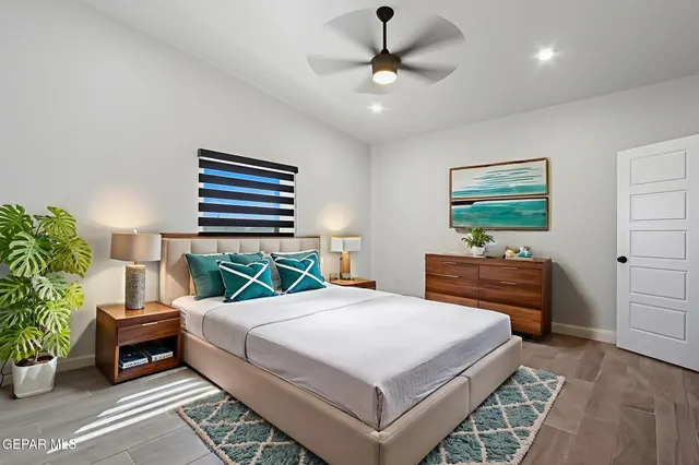 a bedroom with a bed and a dresser