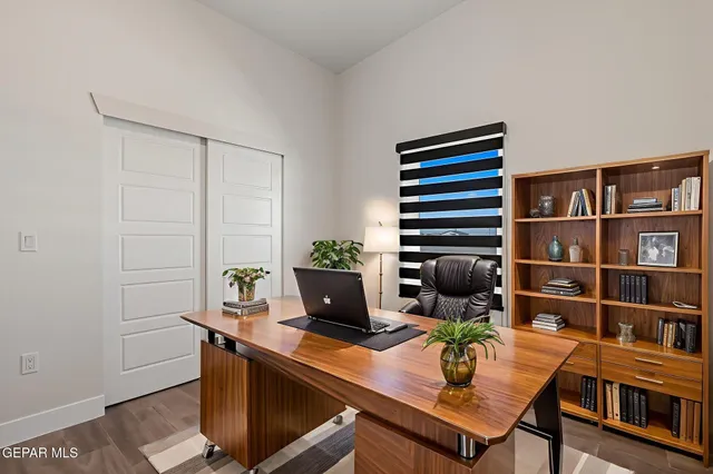 a view of a workspace with furniture