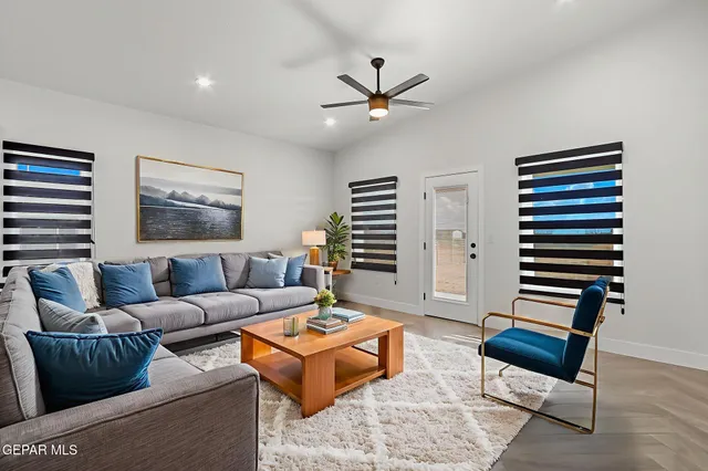 a living room with furniture and a window