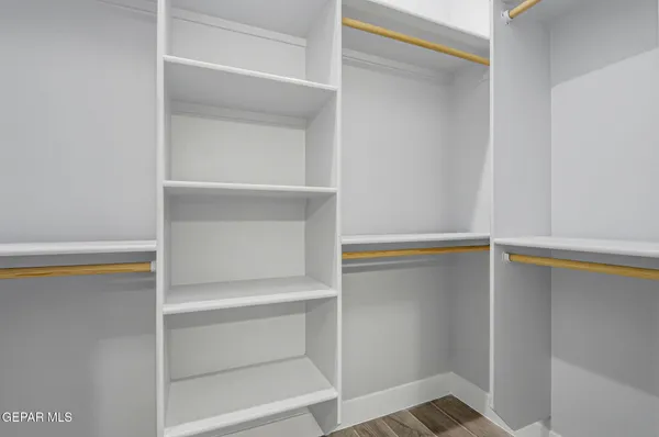 a view of an empty walk in closet