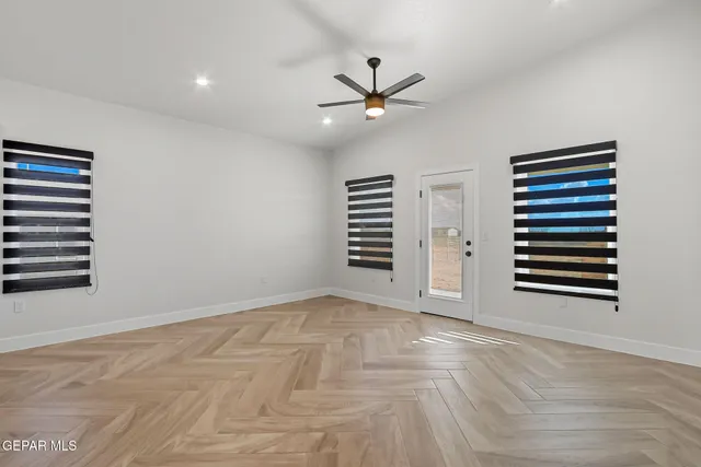 a view of an empty room with a window