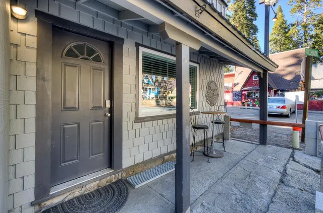 a bathroom with a granite countertop sink mirror toilet and bathtub