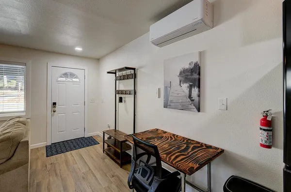 a bedroom with a bed and a chandelier