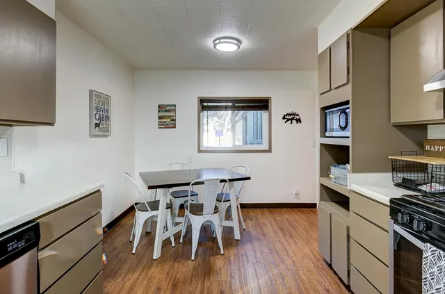 a bathroom with a sink a mirror and a window