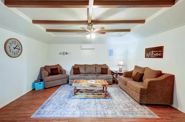 an empty room with a ceiling fan and a window