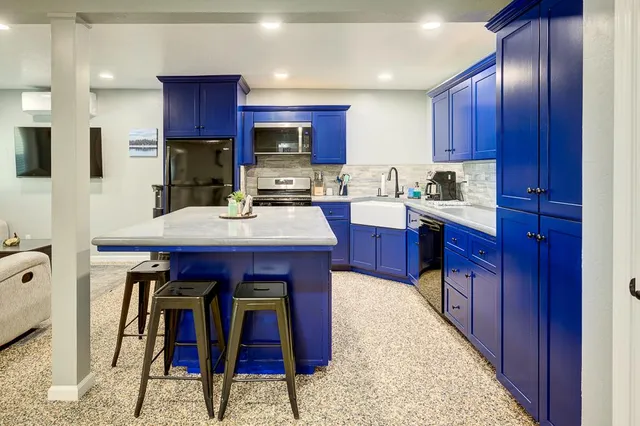 a bedroom with a large bed and a large window