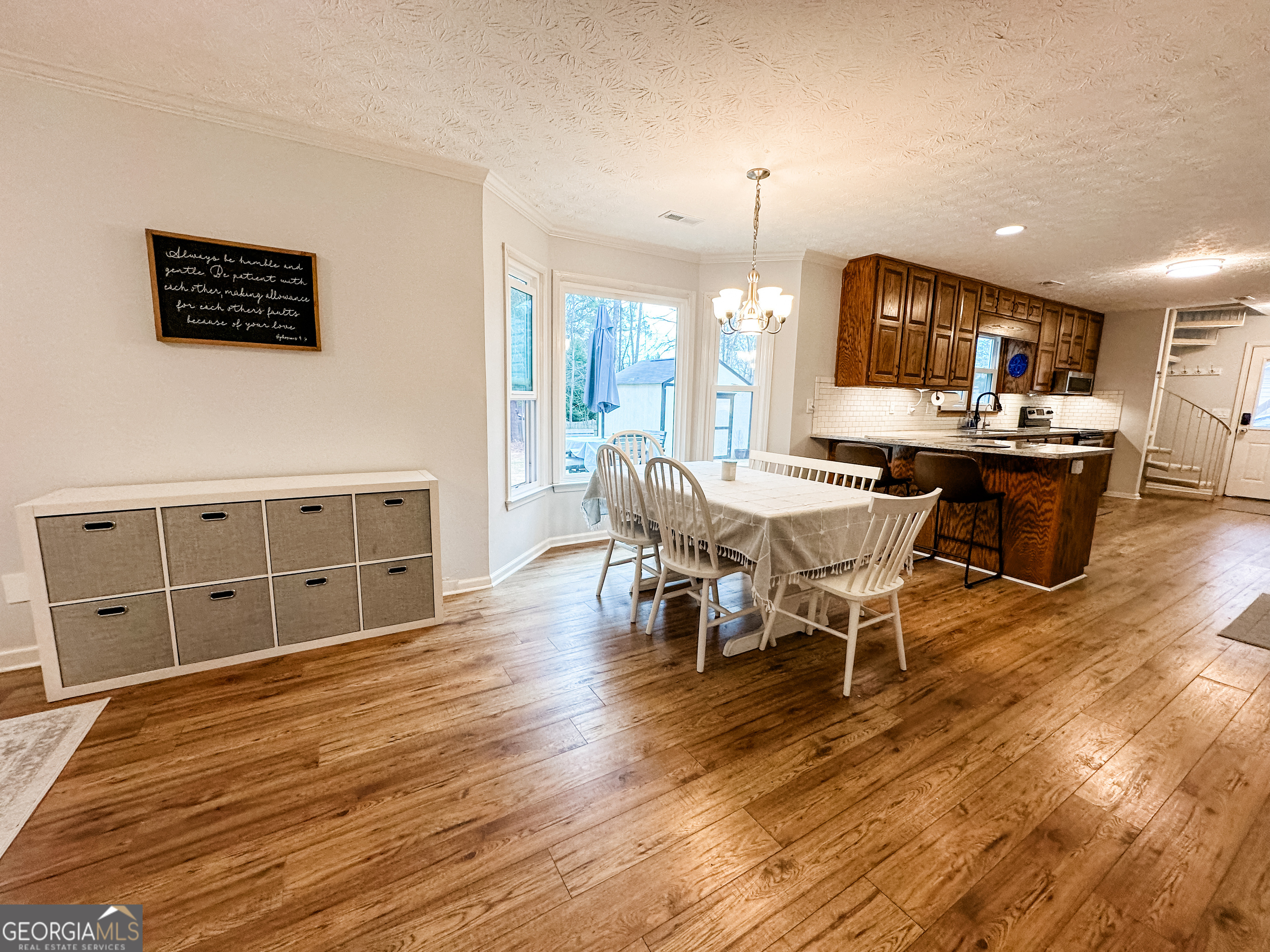 502 Richey Place Peachtree City, GA 30269 - Photo 17 of 61 a view of a dining room with furniture window and wooden floor