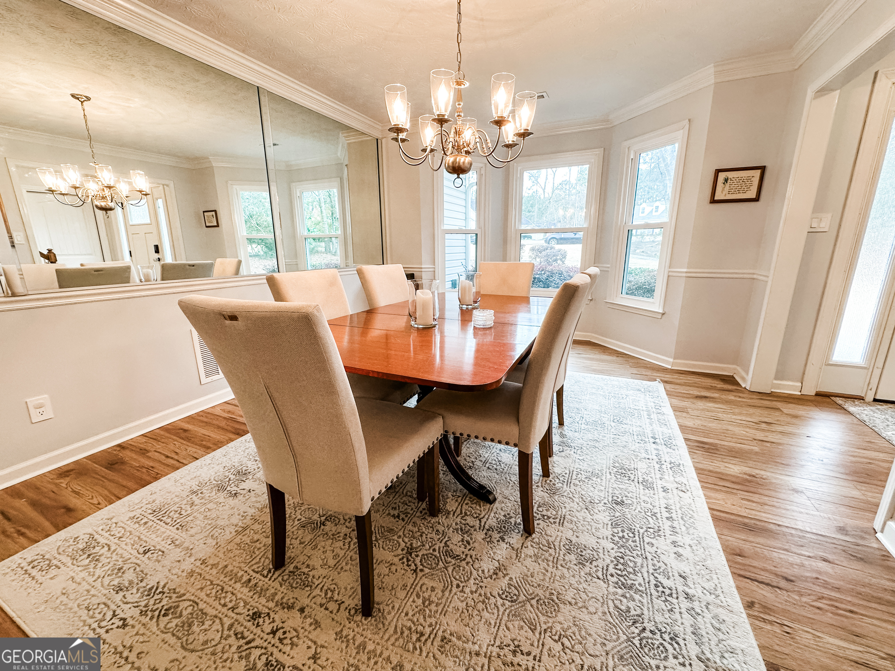 502 Richey Place Peachtree City, GA 30269 - Photo 3 of 61 a view of a dining room with furniture and wooden floor