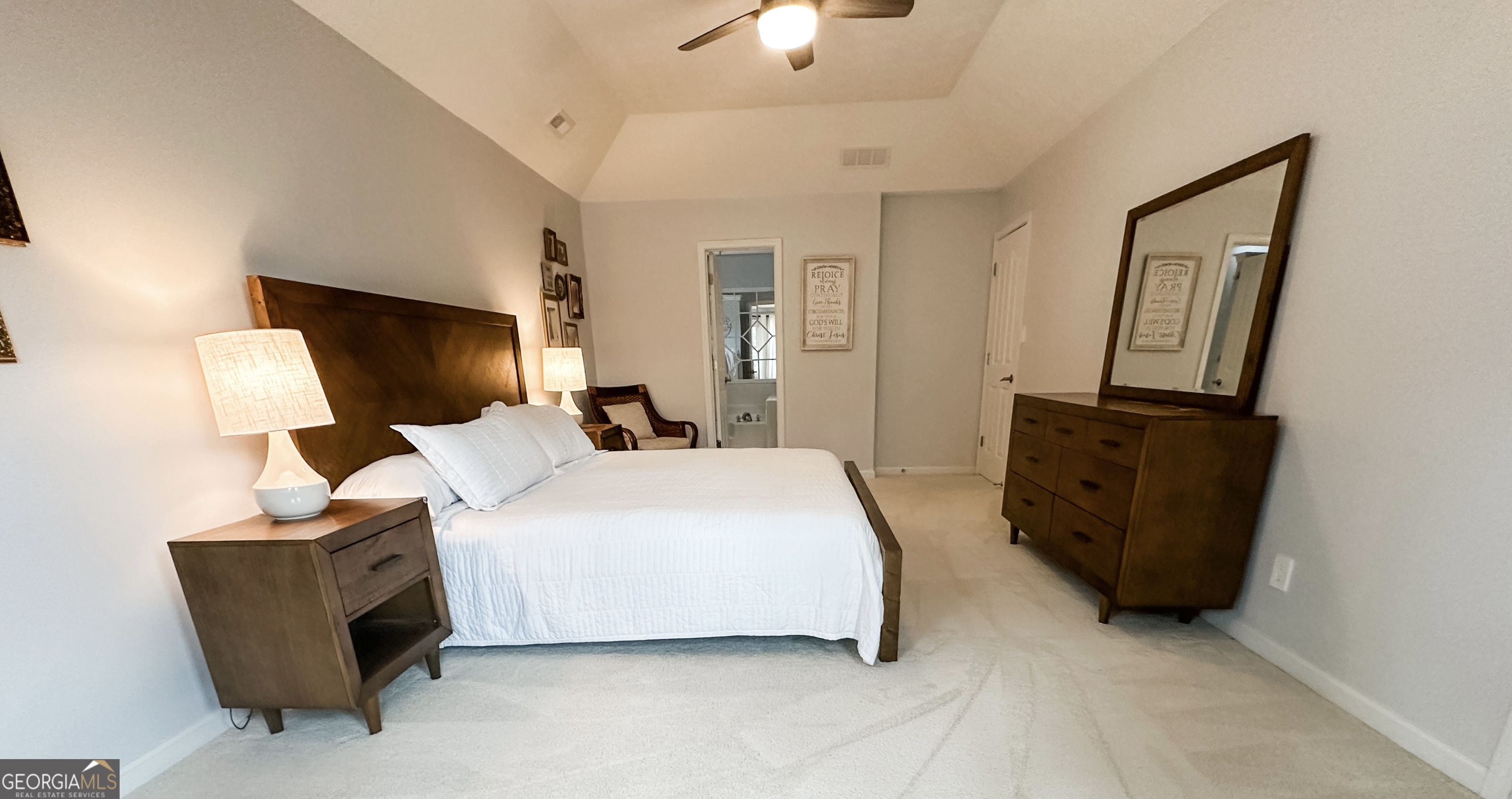 502 Richey Place Peachtree City, GA 30269 - Photo 32 of 61 a bedroom with a bed and mirror