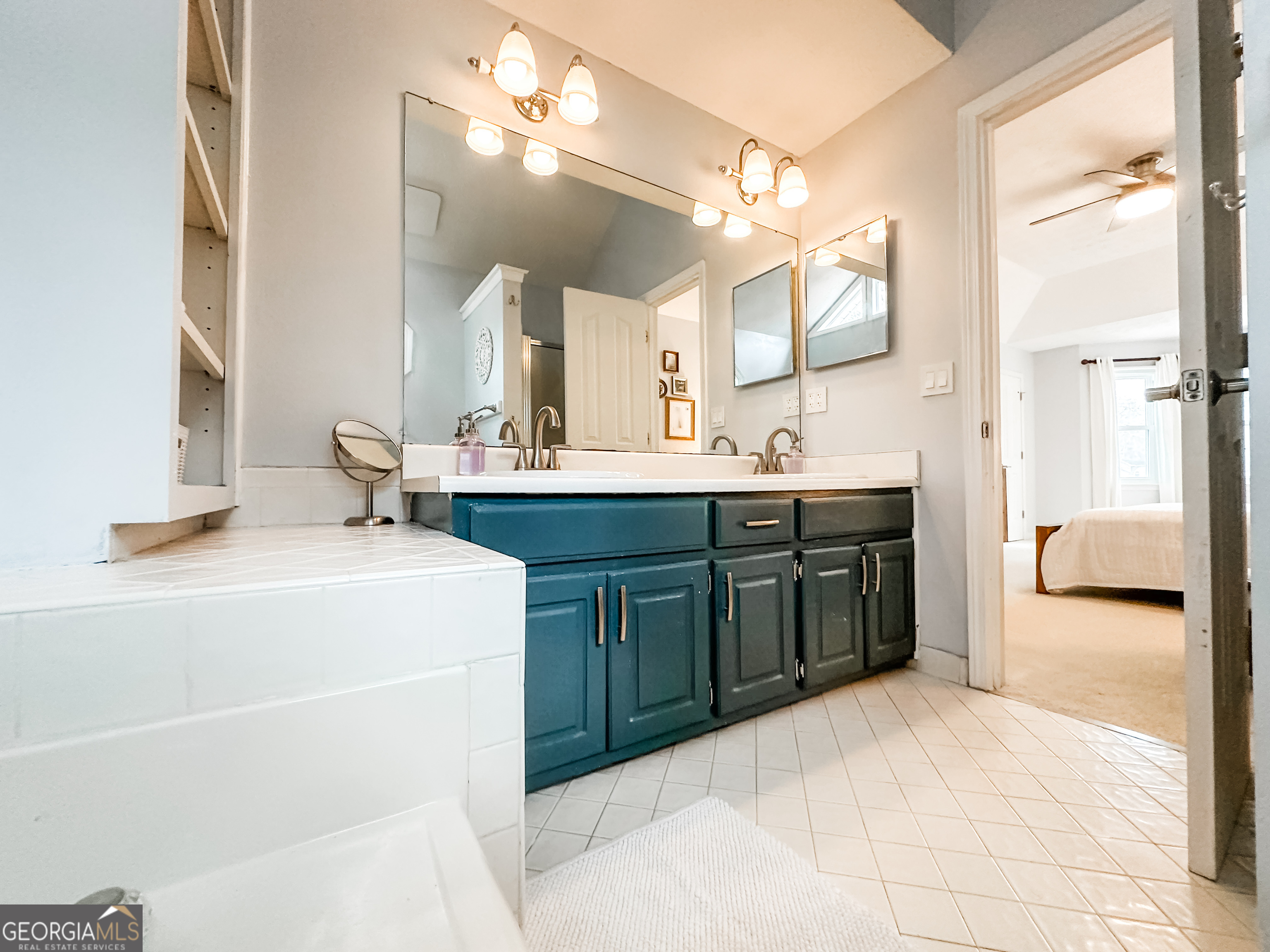 502 Richey Place Peachtree City, GA 30269 - Photo 35 of 61 a bathroom with a sink a vanity and a mirror