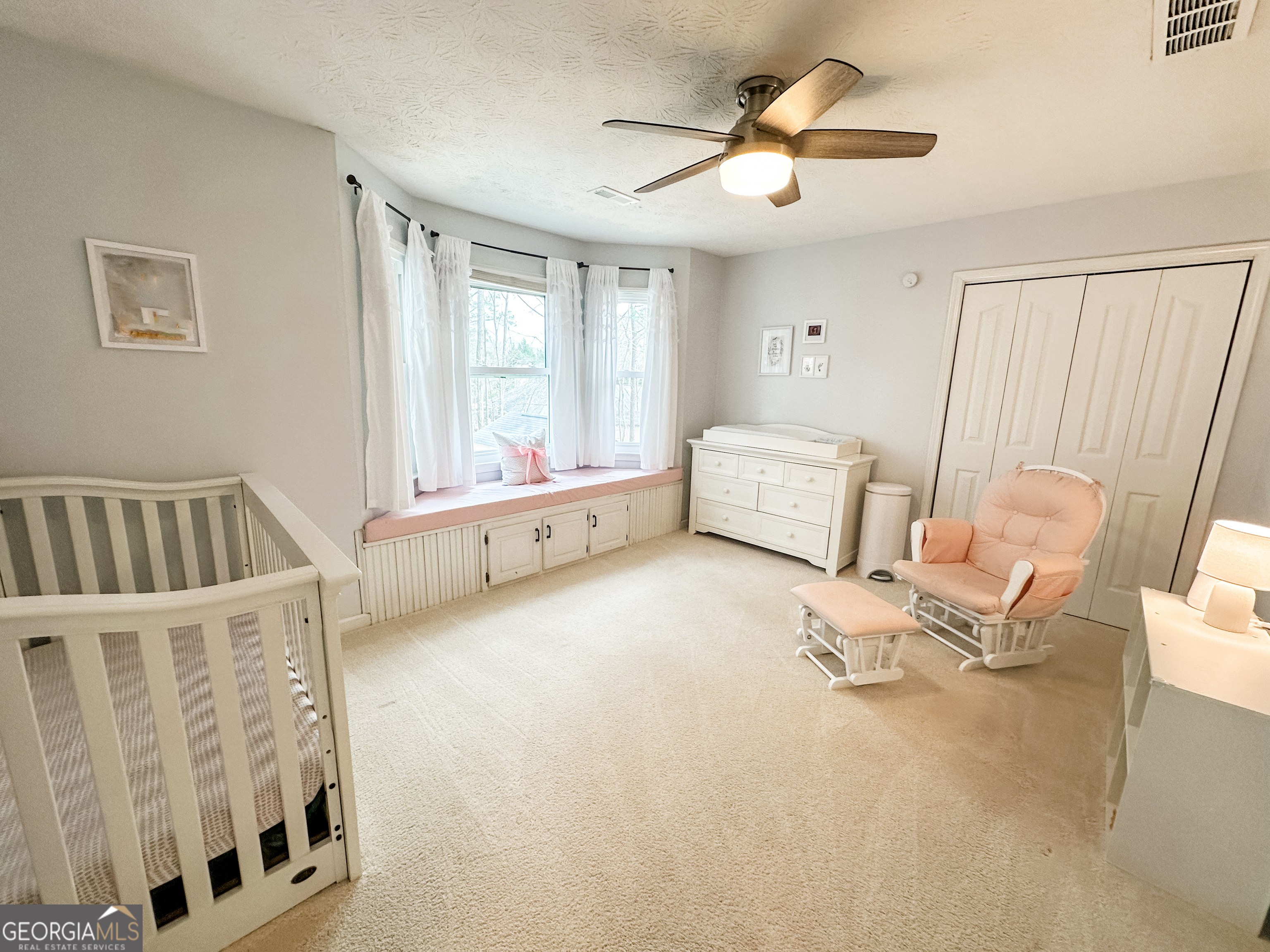 502 Richey Place Peachtree City, GA 30269 - Photo 42 of 61 a bedroom with furniture and a large window