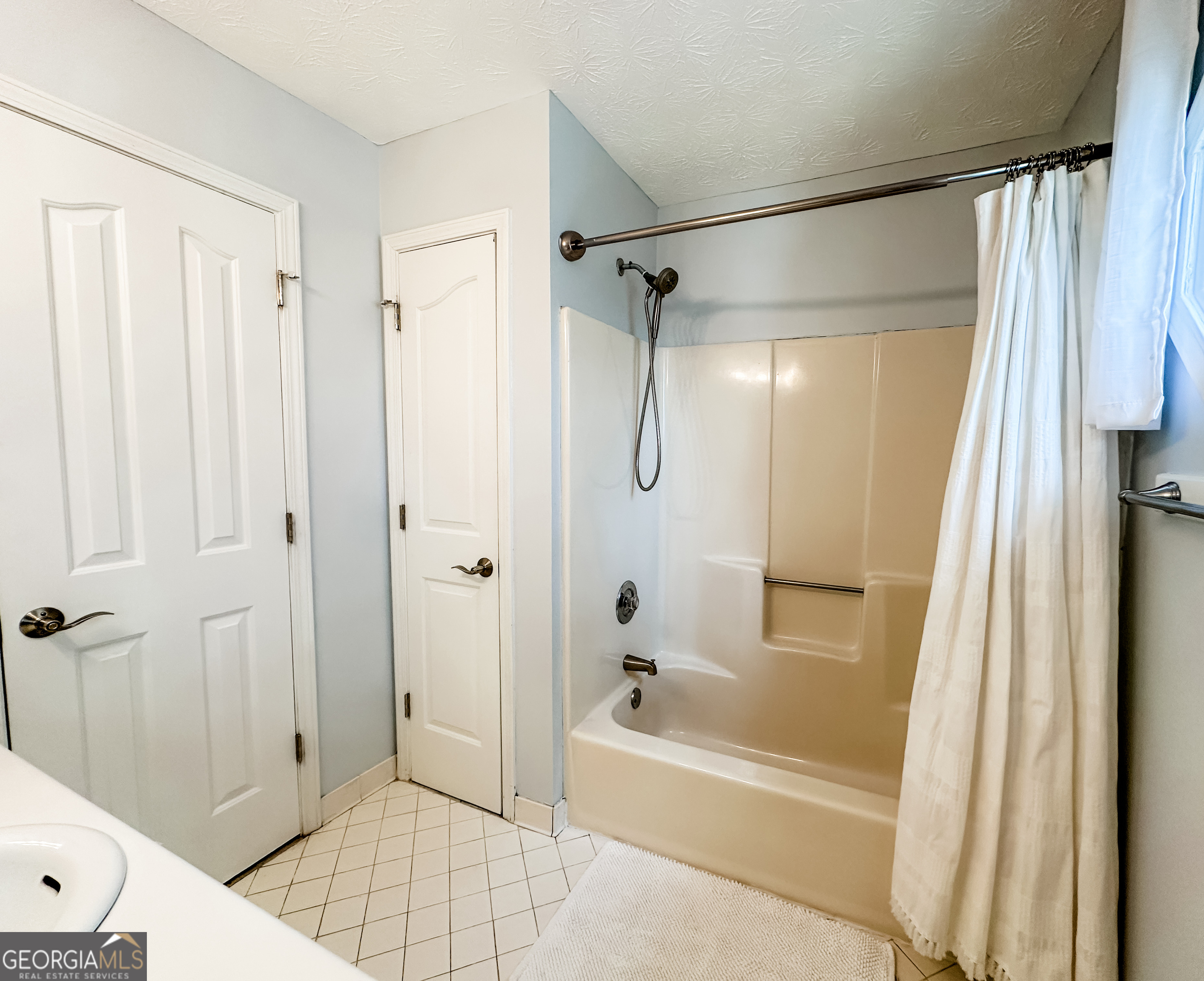 502 Richey Place Peachtree City, GA 30269 - Photo 50 of 61 a bathroom with a shower a bathtub and a shower