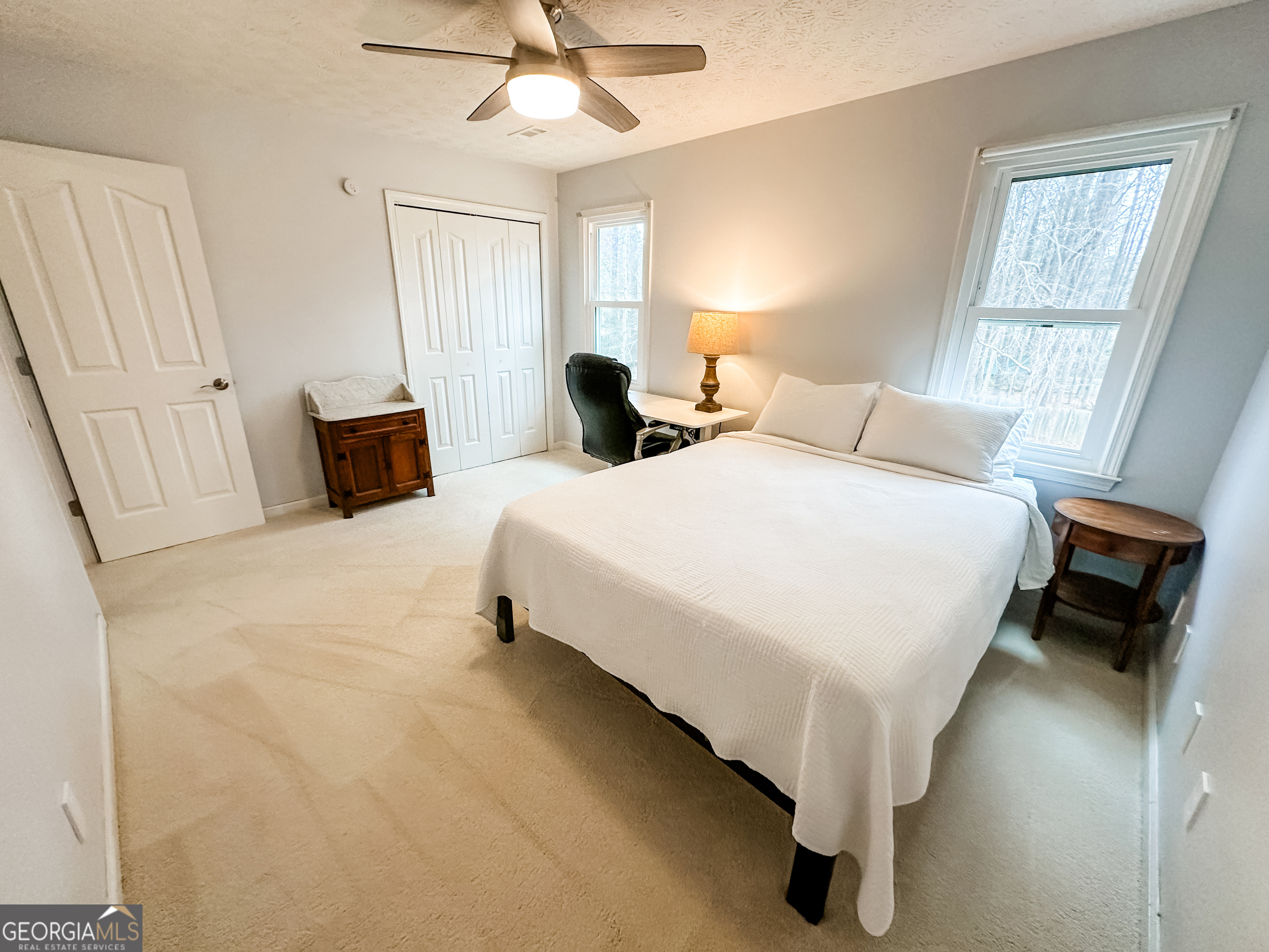502 Richey Place Peachtree City, GA 30269 - Photo 52 of 61 a bedroom with bed and a chandelier
