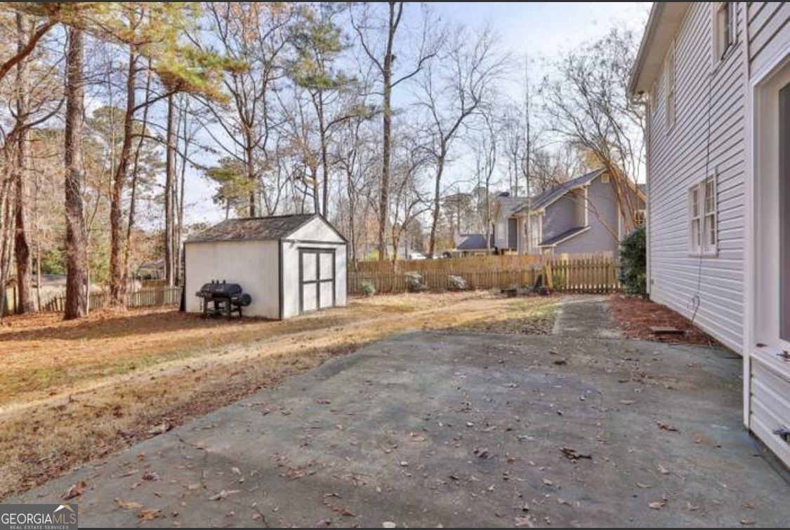 502 Richey Place Peachtree City, GA 30269 - Photo 56 of 61 a big house with palm trees in front of it