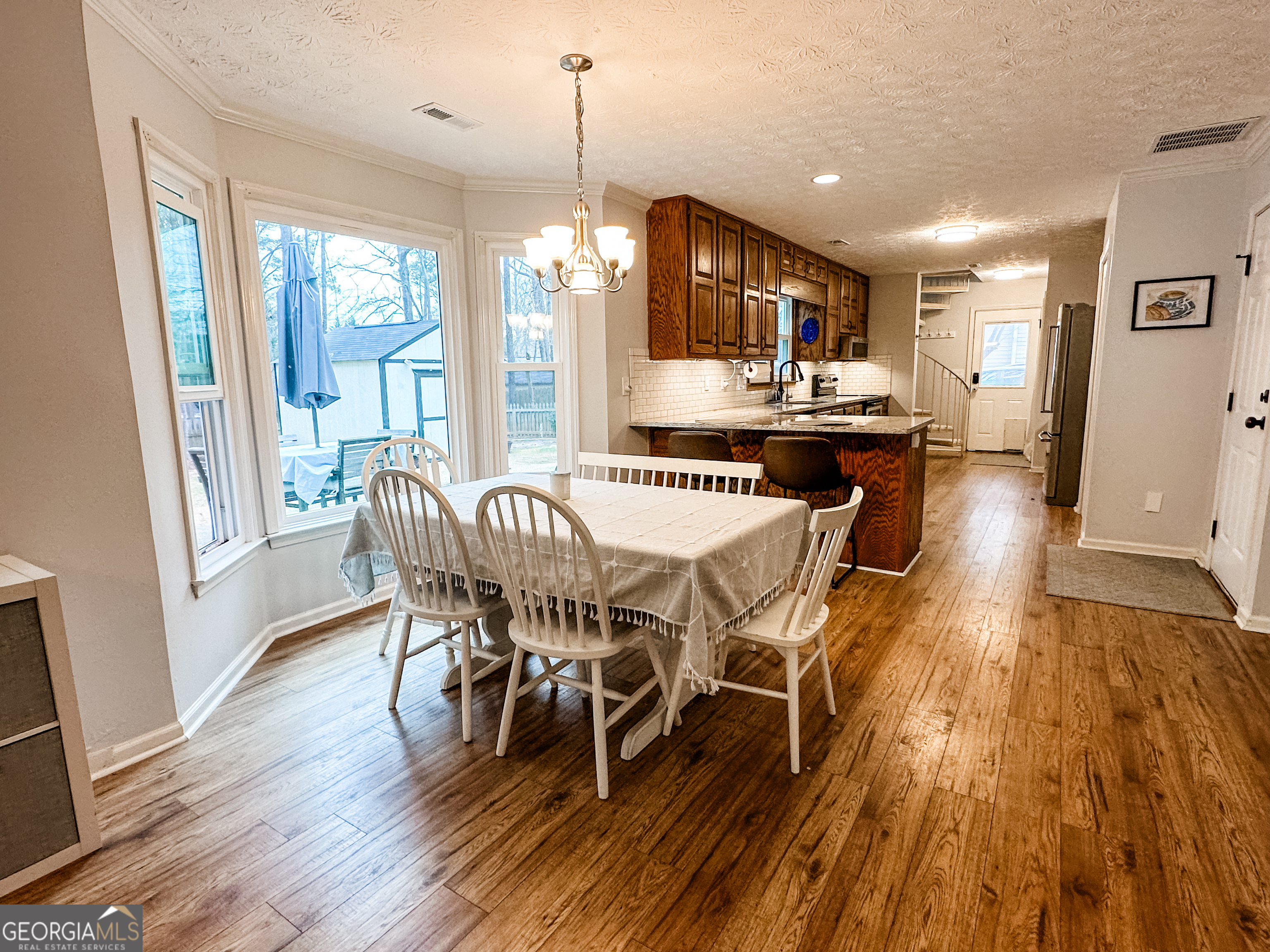 502 Richey Place Peachtree City, GA 30269 - Photo 6 of 61 a view of a dining room with furniture window and wooden floor