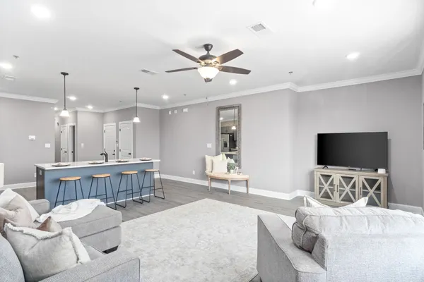 a living room with furniture and a flat screen tv