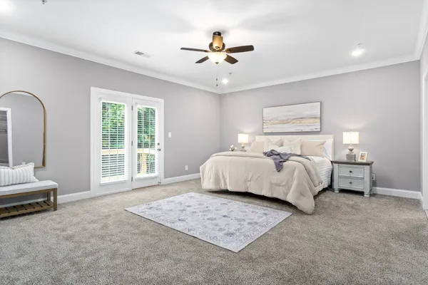 a bedroom with a bed and a table