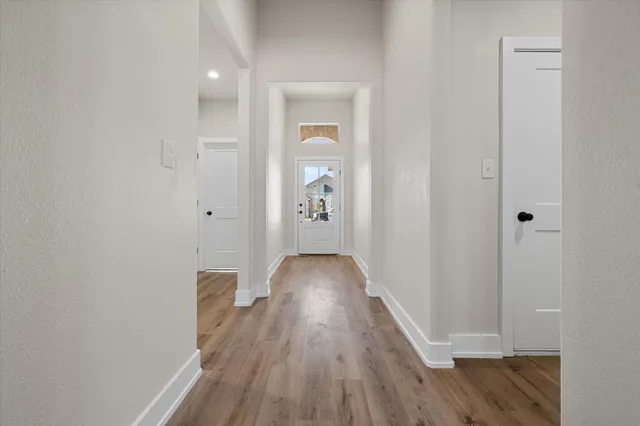 a spacious bedroom with a bed and a window