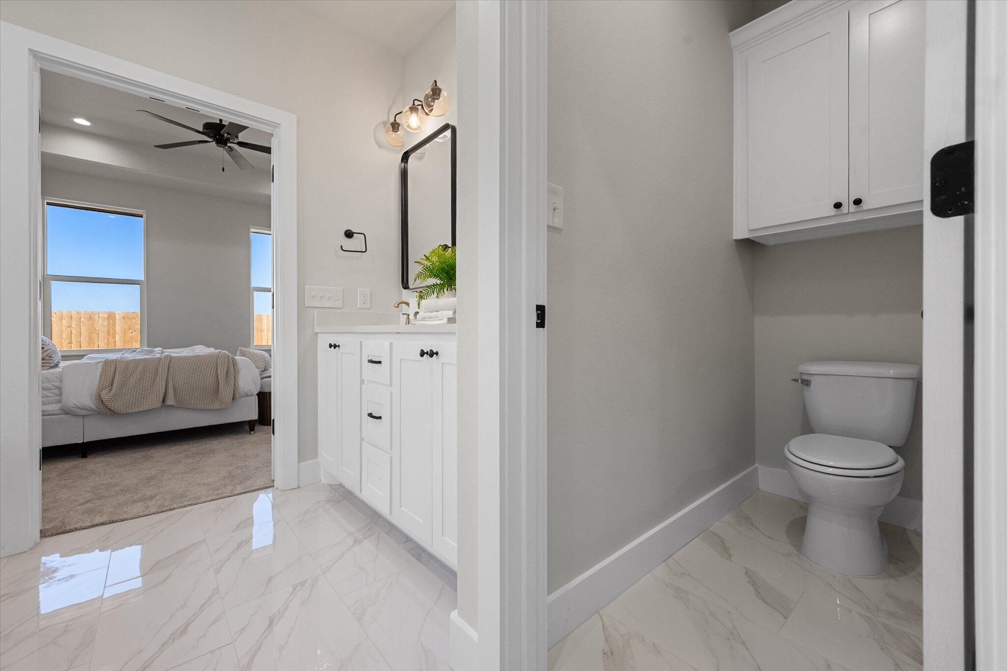 1404 Durham Avenue Wolfforth, TX 79382 - Photo 30 of 34 a en suite bathroom with a toilet