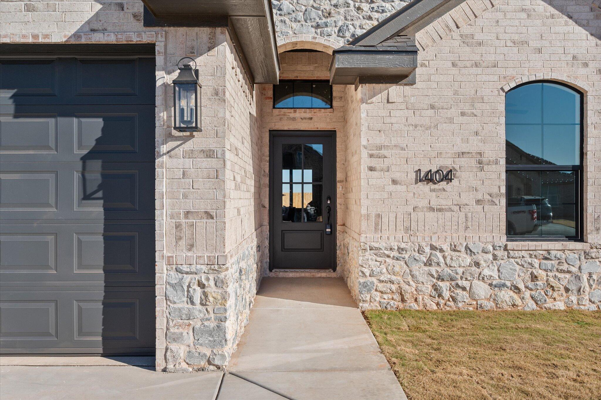 1404 Durham Avenue Wolfforth, TX 79382 - Photo 3 of 34 a front view of a house with an outdoor space
