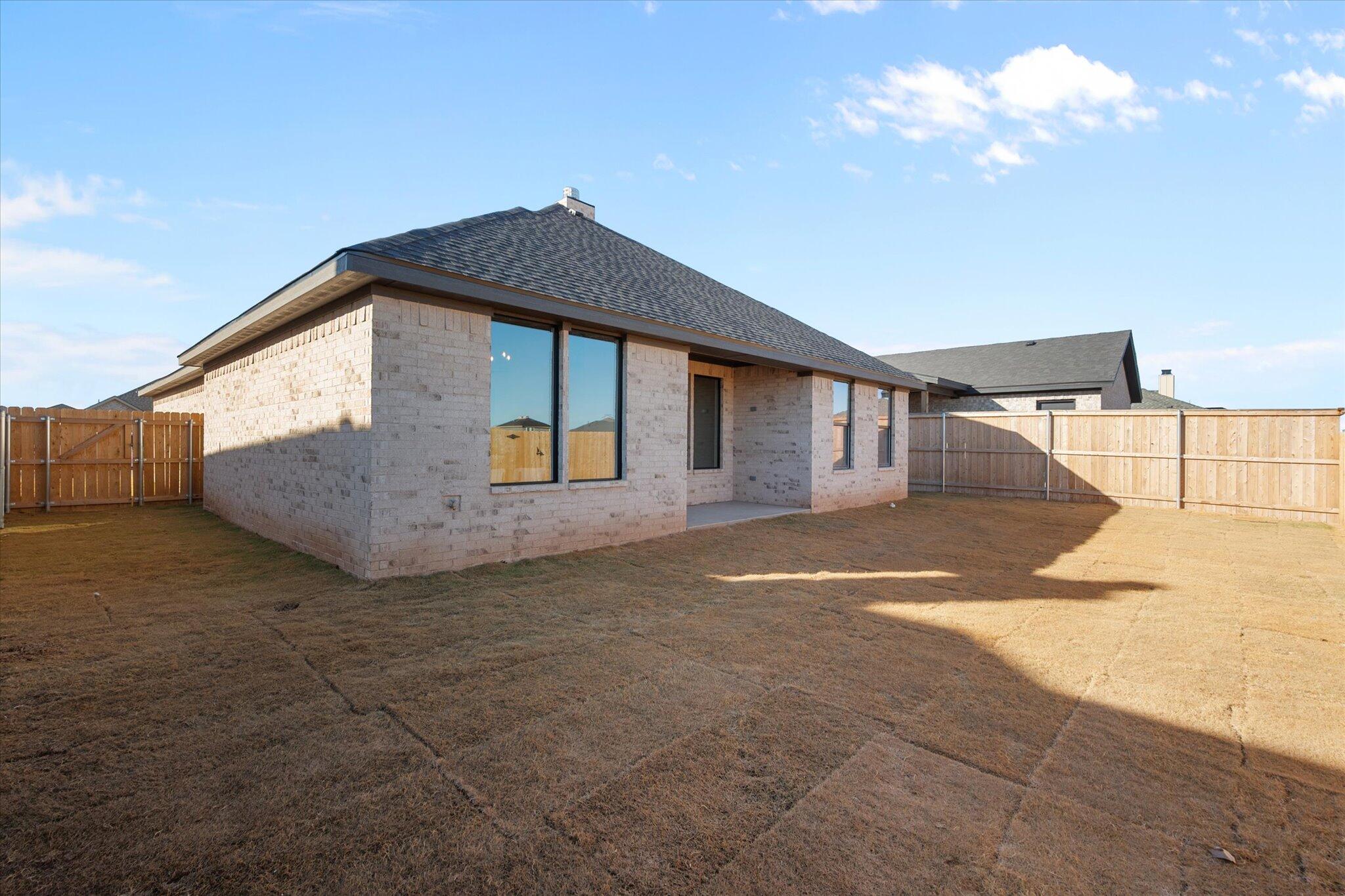 1404 Durham Avenue Wolfforth, TX 79382 - Photo 33 of 34 a view of backyard of a house