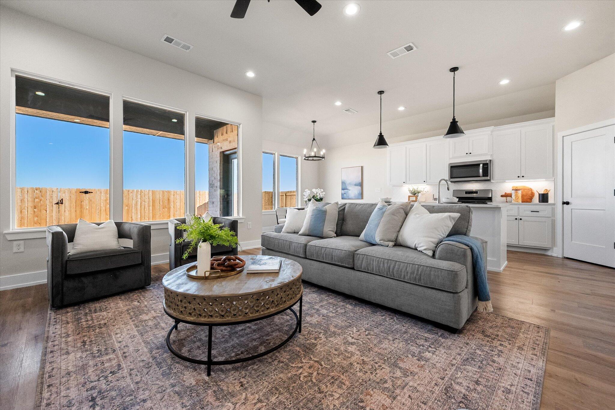 1404 Durham Avenue Wolfforth, TX 79382 - Photo 6 of 34 a living room with furniture and a large window