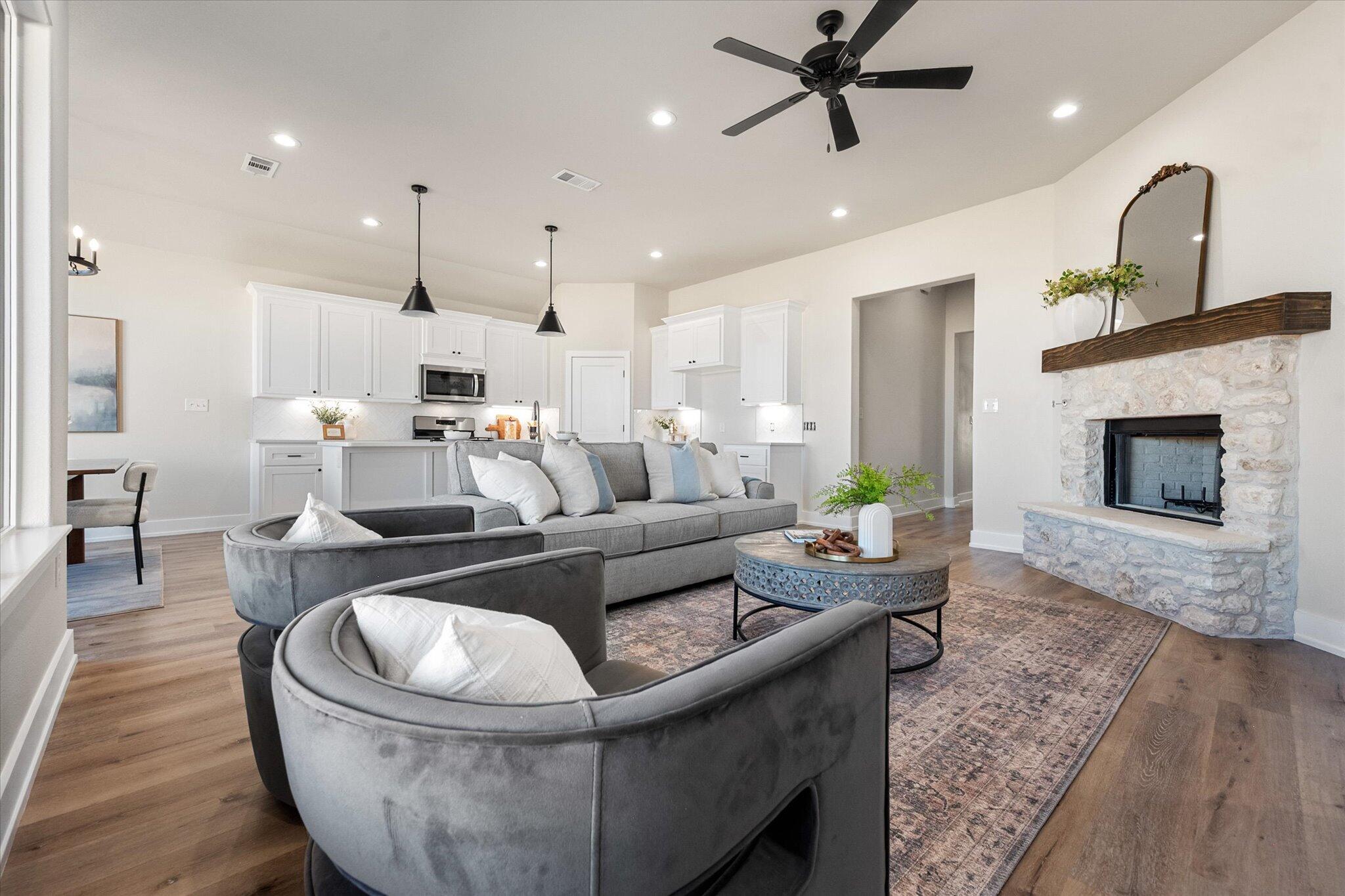 1404 Durham Avenue Wolfforth, TX 79382 - Photo 7 of 34 a living room with furniture and a fireplace