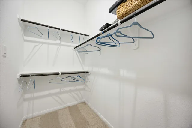 a bathroom with double vanity sink and mirror