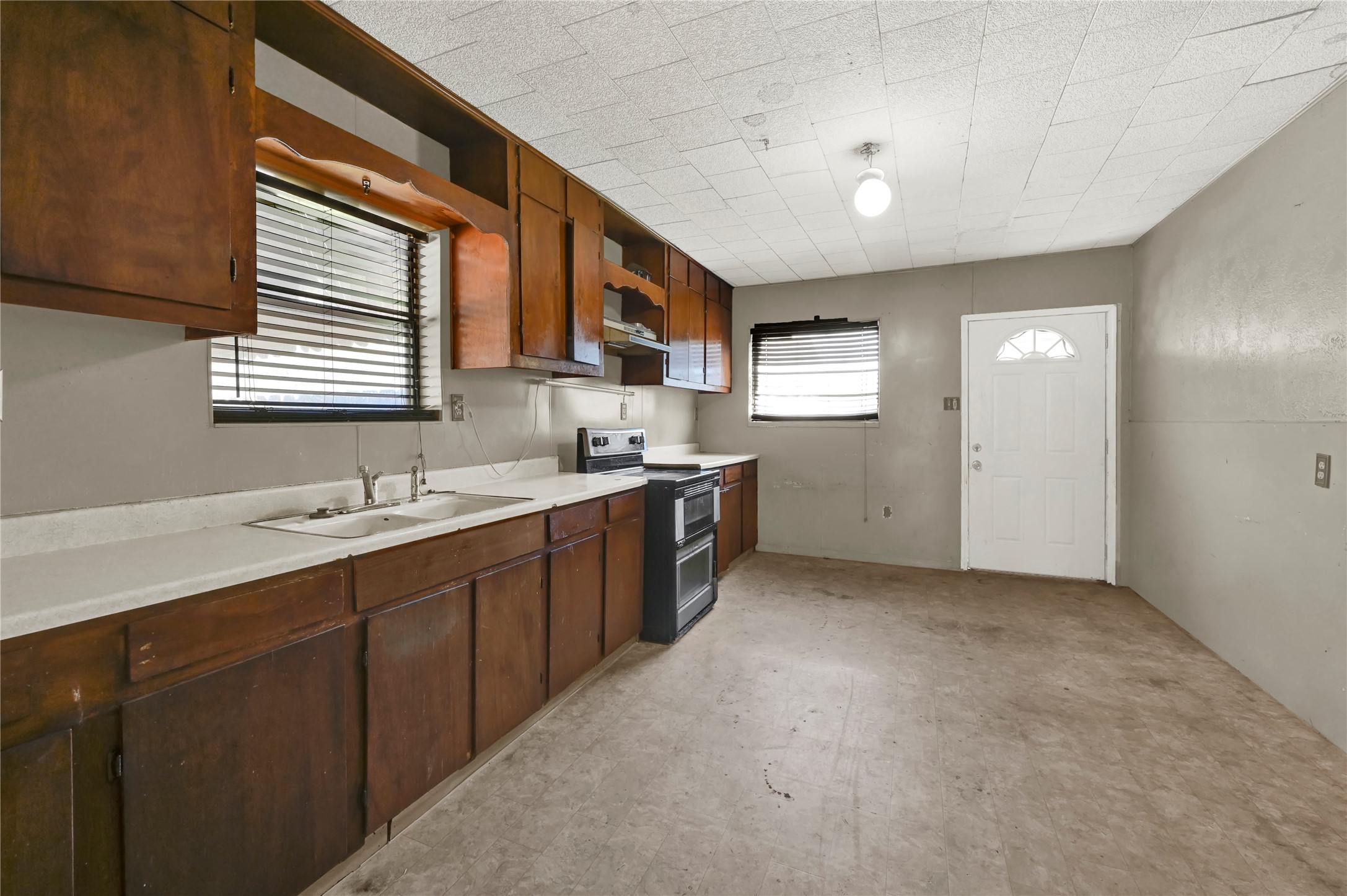 720 Yupon Street Baytown, TX 77520 - Photo 12 of 15 a kitchen with stainless steel appliances granite countertop a sink and a stove